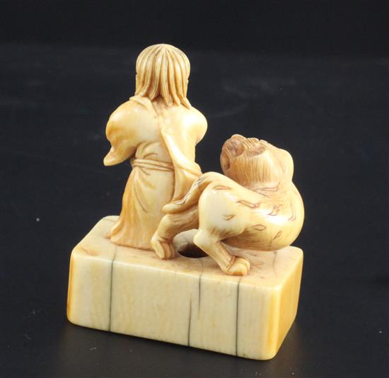 A Japanese ivory netsuke of Binzuru rakan and a tiger, Edo period, height 4.8cm